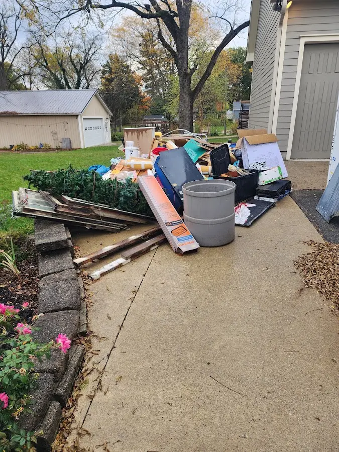 Dumpster being loaded with debris for 3 Yard Dumpster Rental in Loma Linda